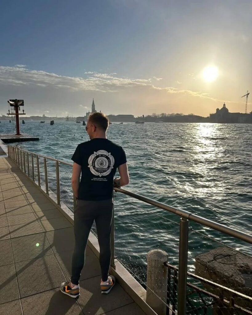The Beer Engine x J Mitchell Design 4 Back view of The Beer Engine Skipton t-shirt worn at sunset on Venice waterfront