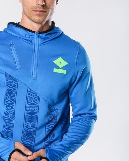 Umbro Tech Hoodie Product Design Blue technical hoodie with geometric patterns and neon Umbro logo designed by Jonathan Mitchell