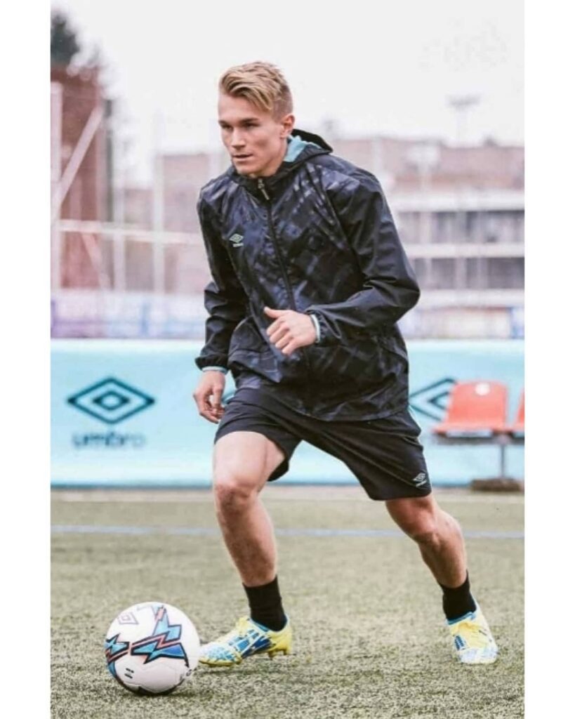 Umbro Technical Trainingwear Design Male footballer training in UX Umbro black sports jacket designed by J Mitchell