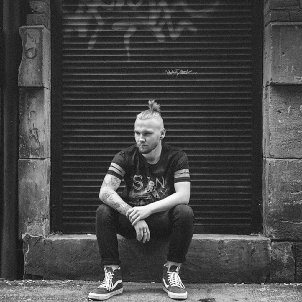 chptr-vrse-streetwear-graphic-tee Black t-shirt with distressed print designed for Chptr and Vrse