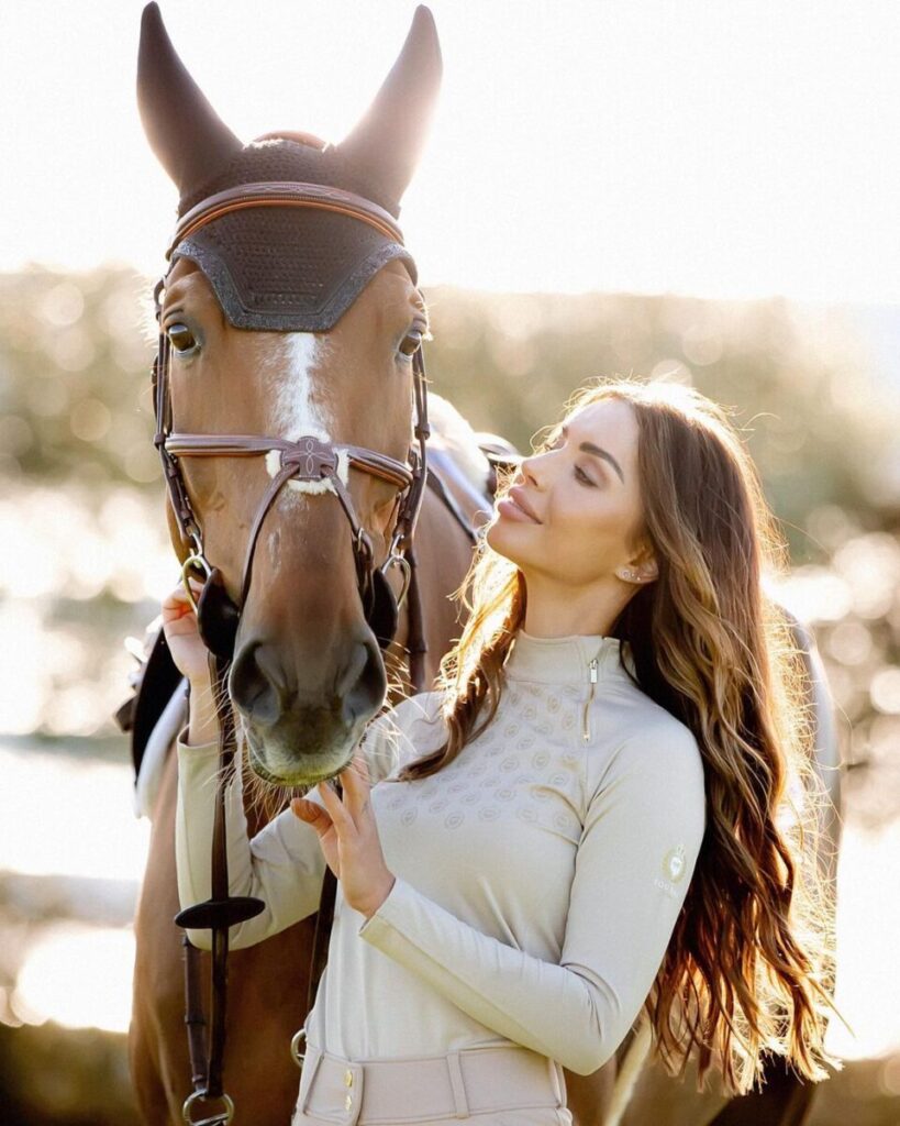 equestrianwear-fashion-startup-equidae-london-jmitchelldesign Nermina Pieters-Mekic wearing equestrianwear standing beside a horse, showcasing startup fashion brand design by Jonathan Mitchell
