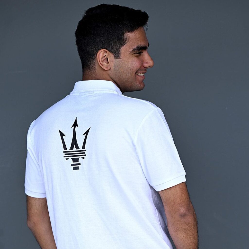 Maserati motorsport white polo shirt back view Back view of Maserati MSG Racing polo shirt featuring large black trident logo