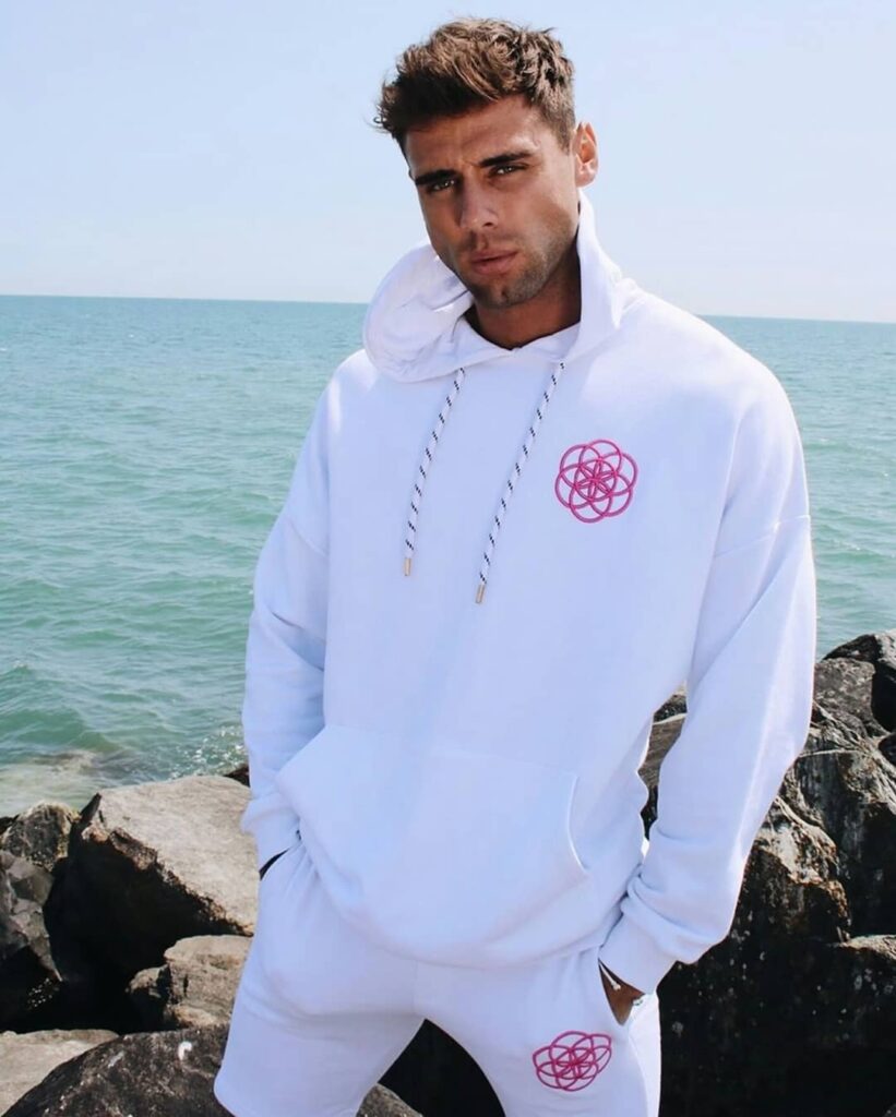 scar-tissue-white-hoodie-and-shorts-streetwear-set White hoodie and shorts loungewear set with pink geometric logo by Scar Tissue