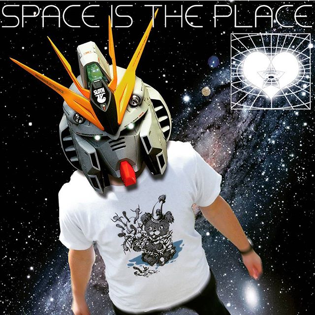 starchild x sloth clothing brighton streetwear fashion design Starchild robot helmet character wearing a graphic tee by Sloth Clothing in a cosmic space backdrop