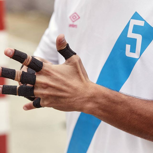 umbro-manchester-activewear-designer Close-up of athlete’s hand taped for indoor football, wearing Umbro jersey designed by J Mitchell Design
