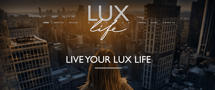 LUXlife Magazine award graphic with the text "LIVE YOUR LUX LIFE", showing a woman looking out over a city skyline at sunset.